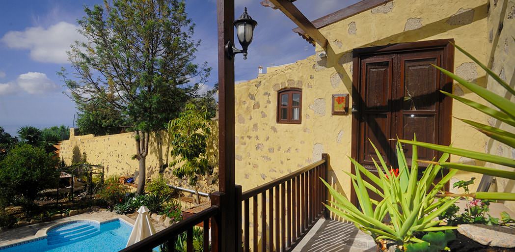 Outside hibiscus cottage with view of pool and gardens, Tenerife - La Bodega, San Miguel, Tenerife.